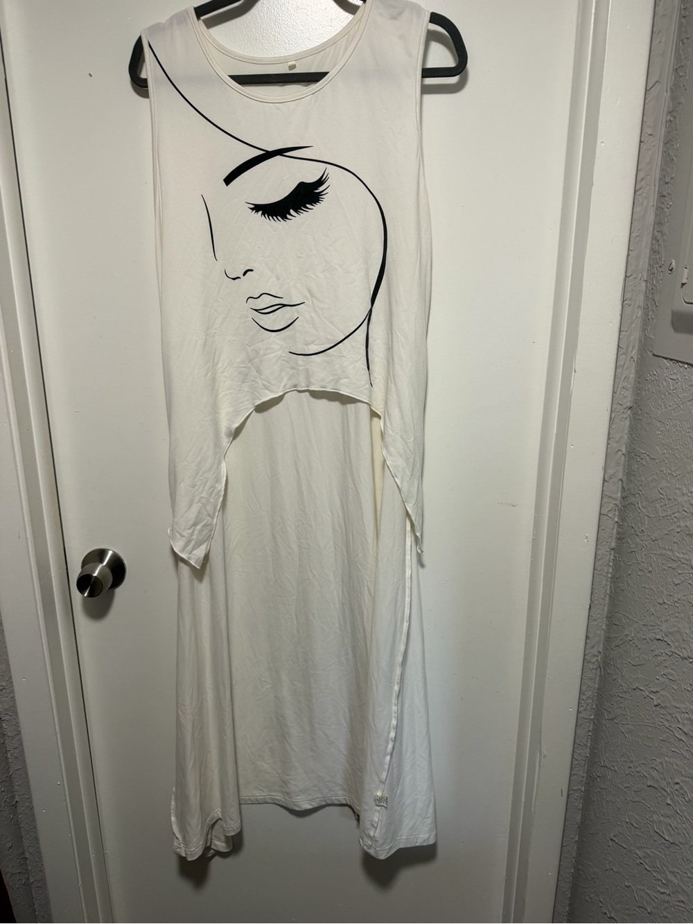 Sleeveless White High-Low Top with Graphic Face Print